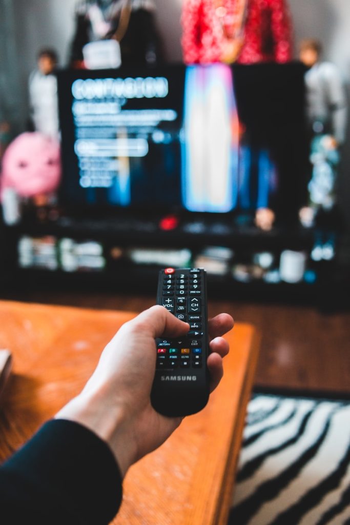 UK’s Top Favourite Reality TV Shows to Appear On person holding black remote control