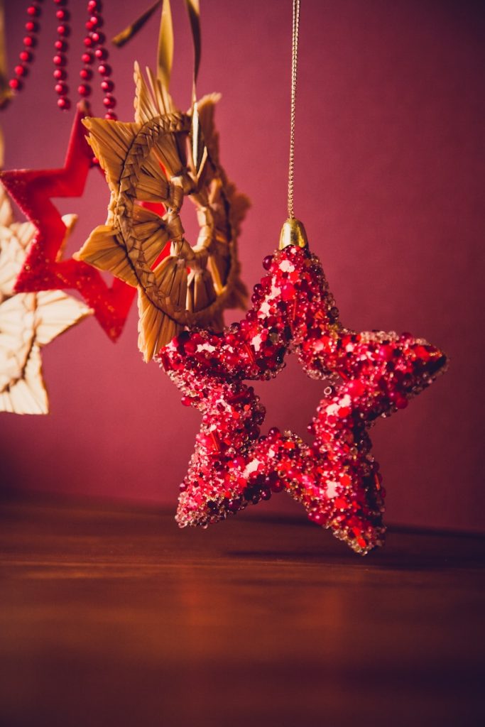 Christmas Magic: Curated Toy Guide for Parents red sequined star handing decor