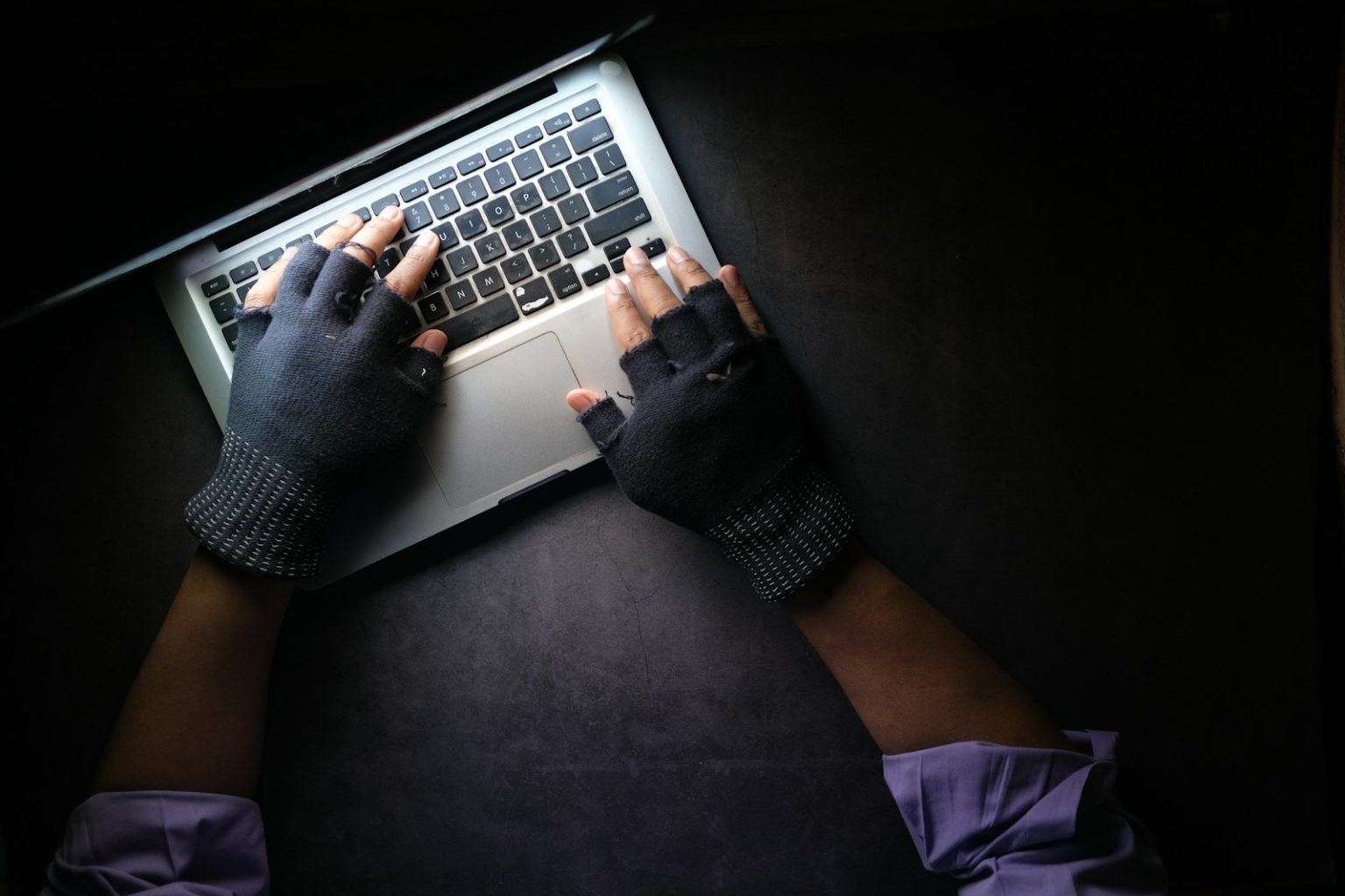 How Cybersecurity Firms Can Become More Competitive person in black long sleeve shirt using macbook pro