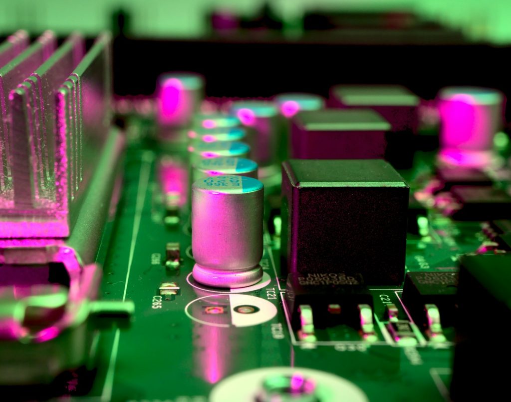DialoX Marketplace: AI Solutions Made Easy by Enreach a close up of a computer motherboard with pink lights