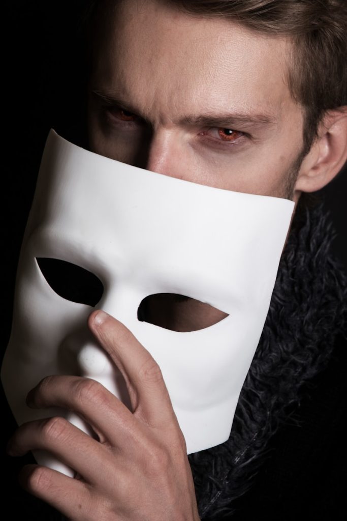 PG Telecom Enhances Scam Call Protection man with white face mask