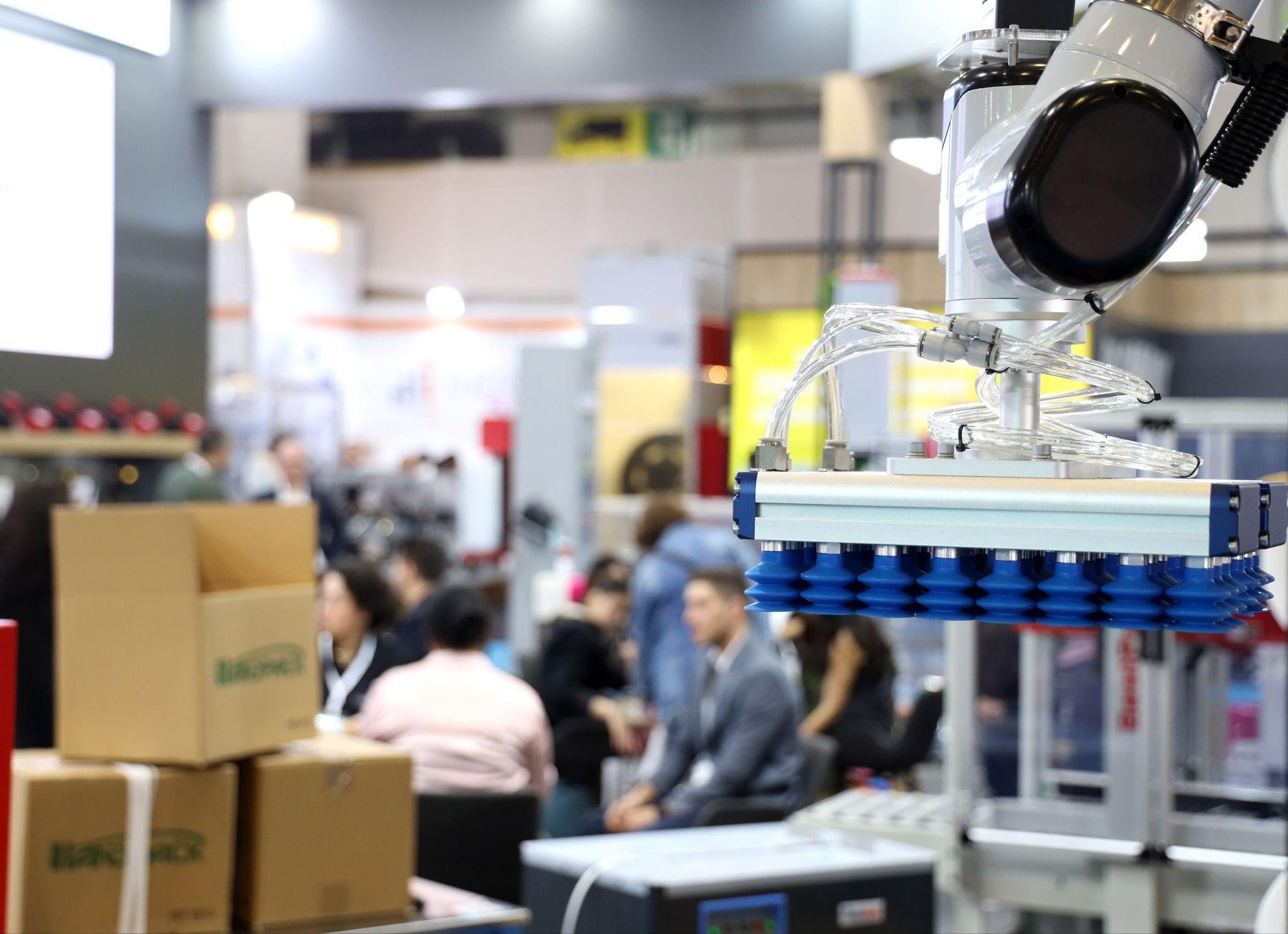 Eurasia Packaging Istanbul marks its 31st edition on 13 to 16 October 2026: a robotic vacuum gripper lifting cartons on an exhibitor stand at Eurasia Packaging Istanbul